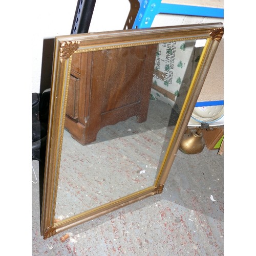 422 - GILT FRAMED MIRROR WITH ART NOUVEAU STYLE CORNERS.