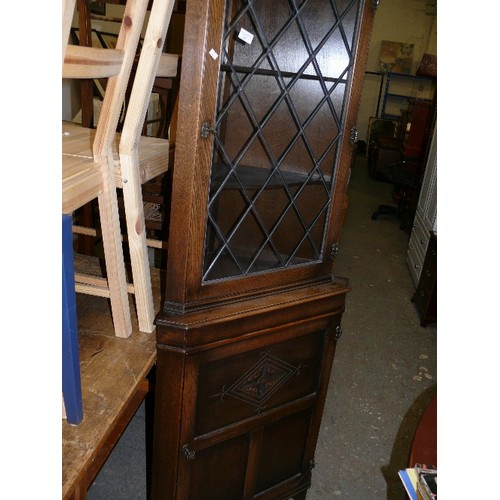 445 - OAK CORNER DISPLAY CABINET, LEADED GLASS TOP DOOR WITH KEY AND CUPBOARD WITH KEY.