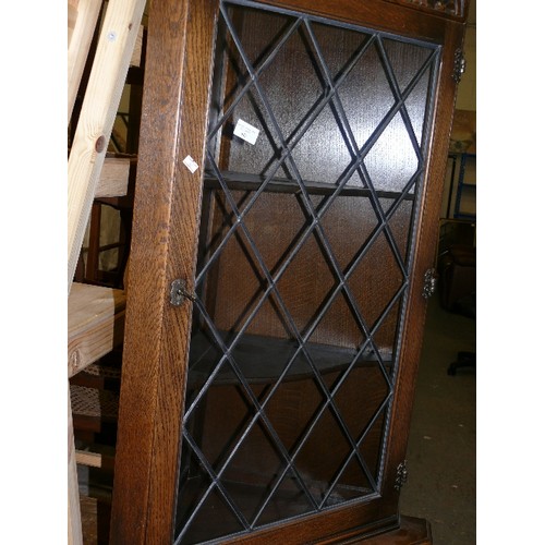 445 - OAK CORNER DISPLAY CABINET, LEADED GLASS TOP DOOR WITH KEY AND CUPBOARD WITH KEY.