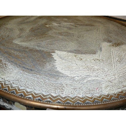 478 - INDIAN CARVED AND PIERCED FOLDING TABLE WITH BRASS TRAY.