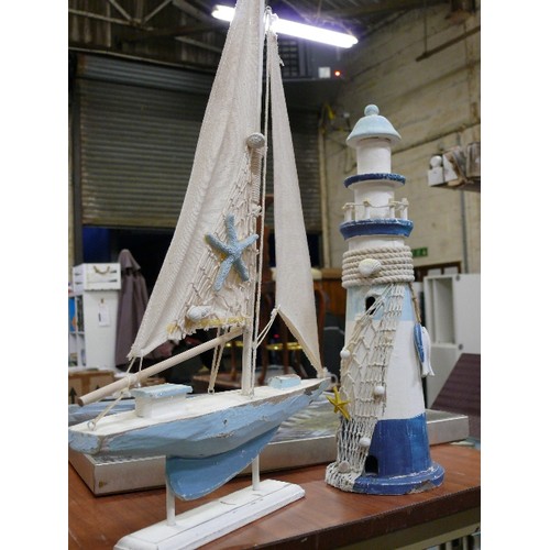 271B - WOODEN YACHT AND A WOODEN  LIGHTHOUSE BOTH IN BLUE AND WHITE.