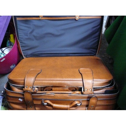 482 - THREE BROWN FAUX LEATHER SUITCASES, STAGGERED SIZES PLUS THREE LOCKS AND KEYS TO TWO.