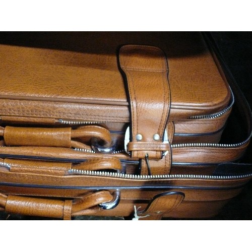 482 - THREE BROWN FAUX LEATHER SUITCASES, STAGGERED SIZES PLUS THREE LOCKS AND KEYS TO TWO.