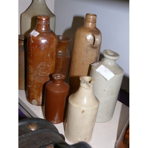 77 - A COLLECTION OF VINTAGE STONEWARE BOTTLES.