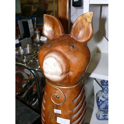 120 - A LARGE WOODEN PIG FIGURE.