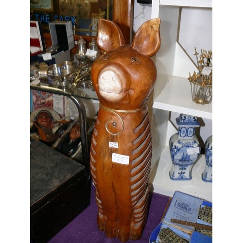 120 - A LARGE WOODEN PIG FIGURE.