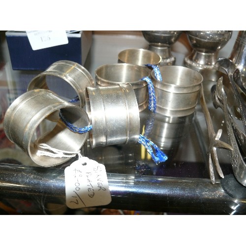 127 - A SELECTION OF SILVER PLATE ITEMS TO INCLUDE CRUET SETS, SUGAR TONGS AND NAPKIN RINGS.