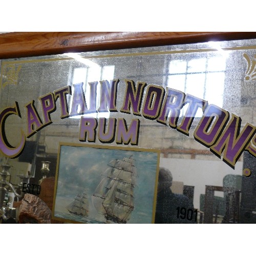 130 - A LARGE PINE FRAMED MIRROR OF CAPTAIN NORTONS RUM.