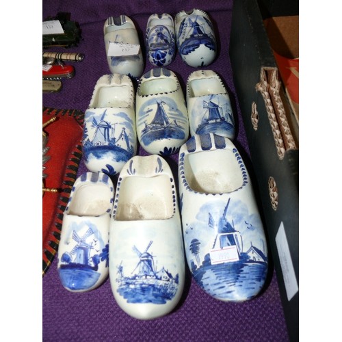 137 - A COLLECTION OF BLUE AND WHITE CERAMIC DELFTWARE CLOGS.