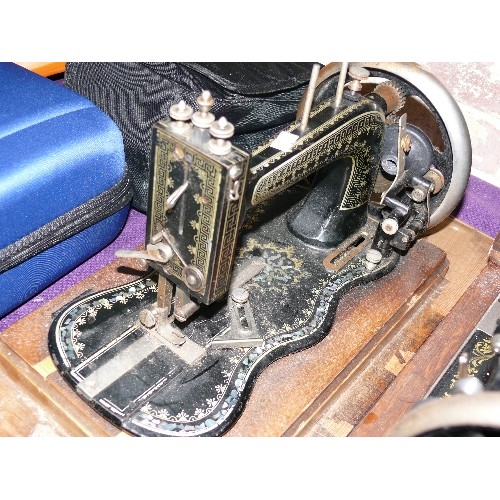 201 - A VINTAGE HAND SEWING MACHINE.