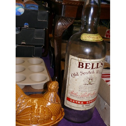 210 - A STONEWARE MUFFIN TRAY BY THE PAMPERED CHEF, CHICKEN EGG CROCK AND A LARGE BELLS WHISKY BOTTLE.