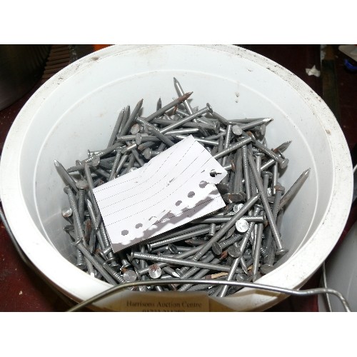 239 - FOUR TUBS OF NAILS INCLUDING ONE TUB OF GALVANISED NAILS.