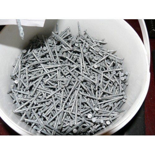 239 - FOUR TUBS OF NAILS INCLUDING ONE TUB OF GALVANISED NAILS.