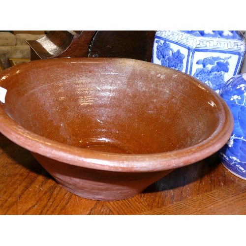 356 - A BROWN GLAZED DAIRY BOWL.