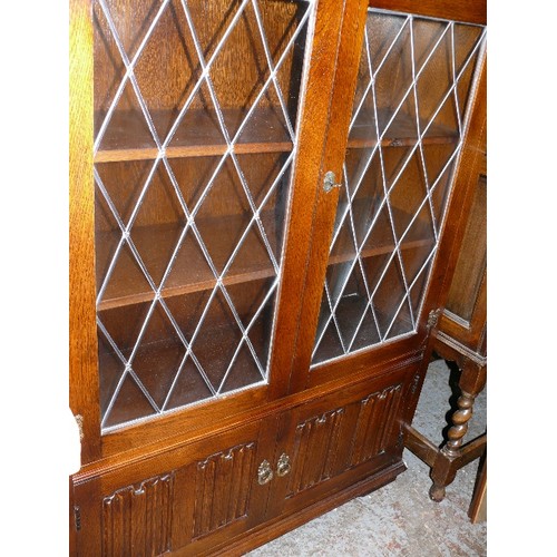 400 - PRIORY DISPLAY CABINET WITH GLAZED DOORS AND CUPBOARDS BELOW.