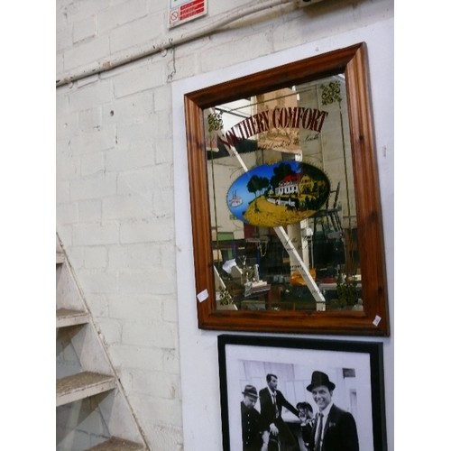 370 - A LARGE PINE FRAMED SOUTHERN COMFORT MIRROR.