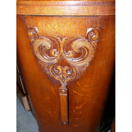 387 - A LARGE WOODEN SIDEBOARD.