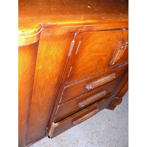 387 - A LARGE WOODEN SIDEBOARD.