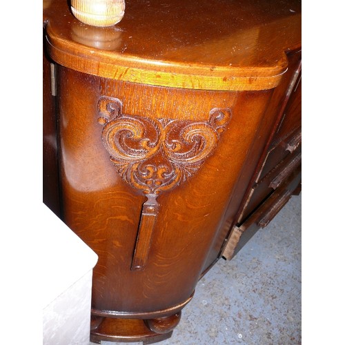 387 - A LARGE WOODEN SIDEBOARD.