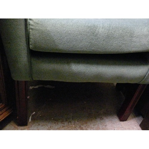 404 - A GREEN WING BACKED ARMCHAIR.