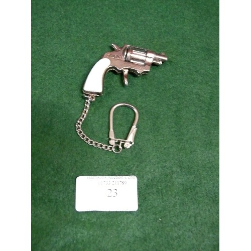 23 - NOVELTY REVOLVER METAL KEYRING, WITH WORKING MOVEMENT, POSSIBLE MINIATURE CAP GUN.