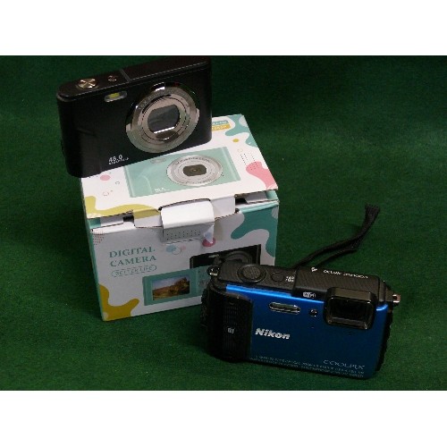 85 - DIGITAL CAMERA MANUAL, MEMORY CARDS AND BATTERY, BOXED PLUS A  NIKON COOLPIX CAMERA.