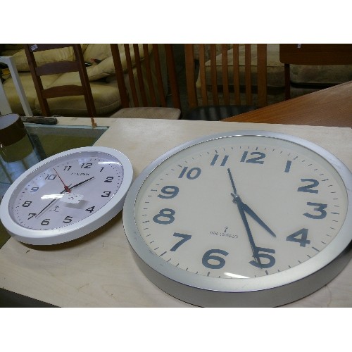 480 - TWO ROUND WALL CLOCKS MADE BY 'RADIO CONTROLLED'.