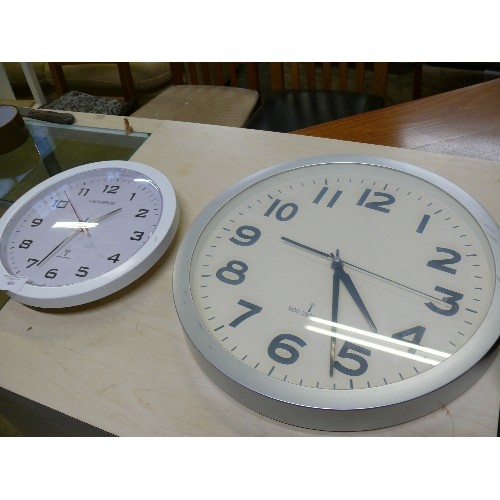 480 - TWO ROUND WALL CLOCKS MADE BY 'RADIO CONTROLLED'.