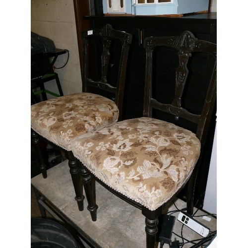 463 - THREE CARVED EDWARDIAN EBONISED CHAIRS WITH UPHOLSTERED SEATS.