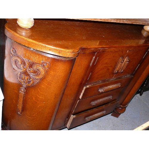 387 - A LARGE WOODEN SIDEBOARD.