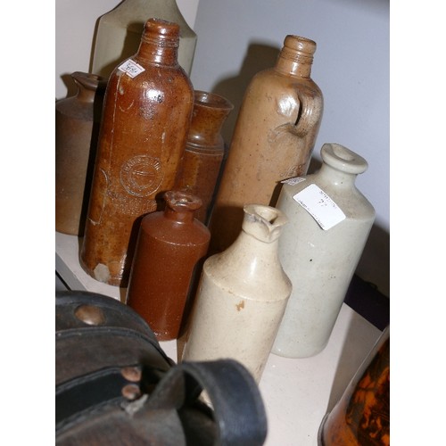 77 - A COLLECTION OF VINTAGE STONEWARE BOTTLES.