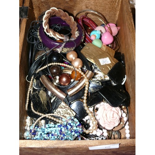 69 - WOODEN CHEST WITH CONTENTS OF A LARGE QUANTITY OF COSTUME JEWELLERY.