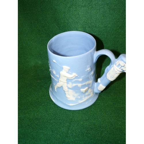 97 - A GOLF THEMED TANKARD BY DARTMOUTH POTTERY.