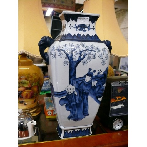 325 - A LARGE VERY HEAVY BLUE AND WHITE PORCELAIN JAPANESE VASE.