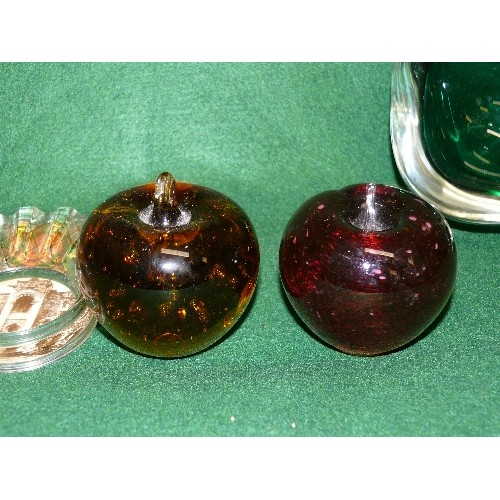 83 - A SELECTION OF COLOURED GLASS PAPERWEIGHTS.