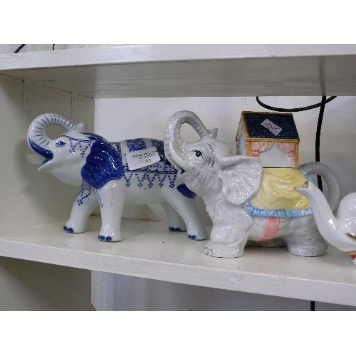 95 - FOUR ELEPHANT THEMED CERAMIC TEAPOTS.