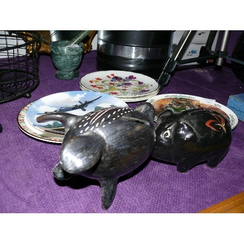 164 - A THREE LEGGED WOODEN PIG MONEY BOX AND A CERAMIC PIG MONEY BOX.