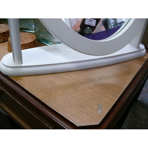 355 - A WHITE OVAL DRESSING TABLE MIRROR.