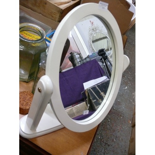 355 - A WHITE OVAL DRESSING TABLE MIRROR.