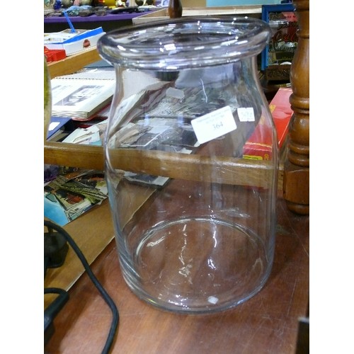 364 - LARGE HAND MADE GLASS JAR WITH ROLL TOP NECK.