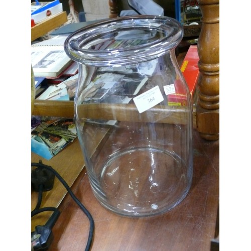 364 - LARGE HAND MADE GLASS JAR WITH ROLL TOP NECK.