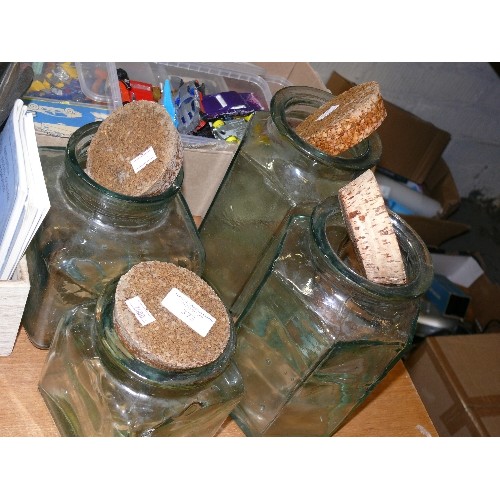 373 - FOUR SPANISH GLASS STORAGE JARS WITH CORK LIDS.