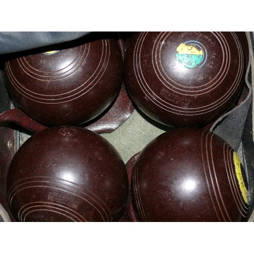 380 - SET OF LAWN BOWLS IN A TARTAN BOWLS BAG.