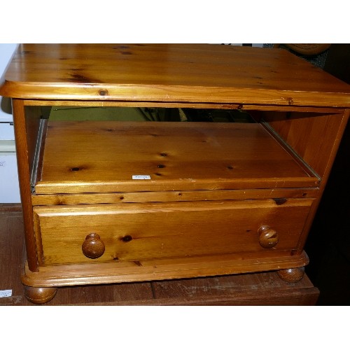 429 - SMALL PINE MEDIA CABINET WITH DRAWER AND PULL OUT SHELF.