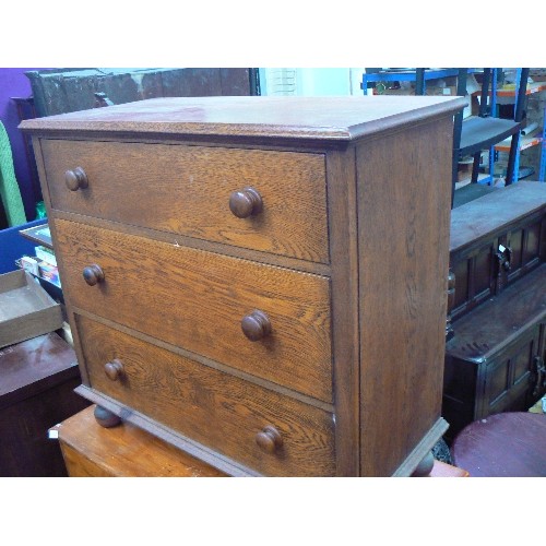 383 - Early 20th Century small oak chest of three drawers with original turned knobs, raised on turned fee... 