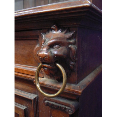 385 - Large Victorian mahogany sideboard with ornate panelled doors between split column sides, carved lio... 