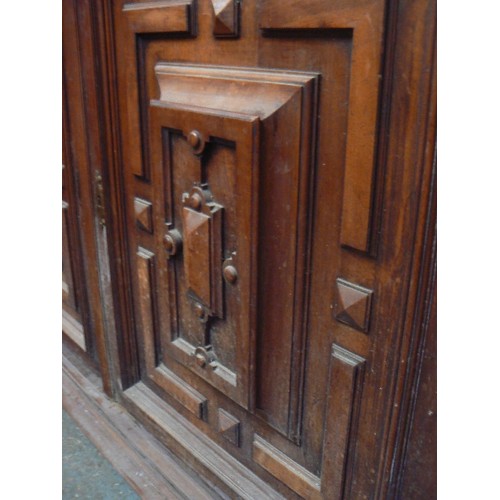 385 - Large Victorian mahogany sideboard with ornate panelled doors between split column sides, carved lio... 