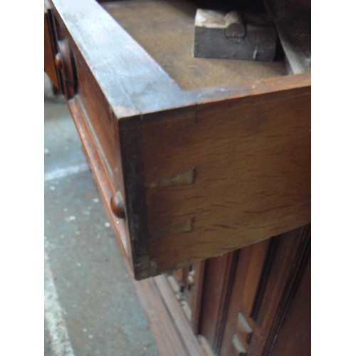 385 - Large Victorian mahogany sideboard with ornate panelled doors between split column sides, carved lio... 