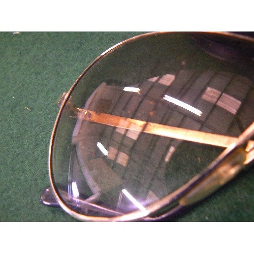 83 - A PAIR OF FOLDABLE FERRARI SUNGLASSES IN ORIGINAL CASE (scratches on one lens).