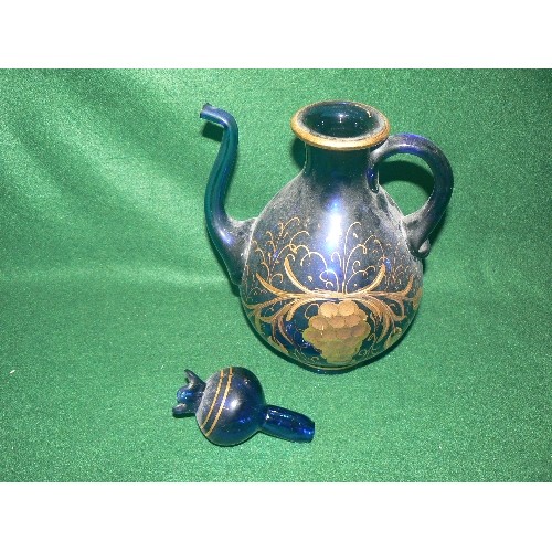 76 - A DECORATIVE HEAVY BLUE GLASS TEAPOT WITH GOLD DETAIL.